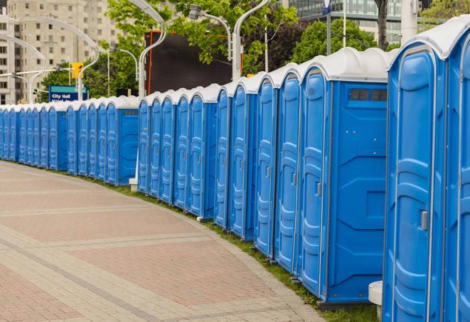 a row of portable restrooms at a fairground, offering visitors a clean and hassle-free experience in goltry